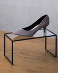 Shoe and accessory display riser with black leather finish